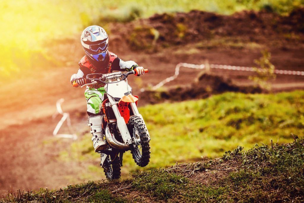 Racer child on motorcycle participates